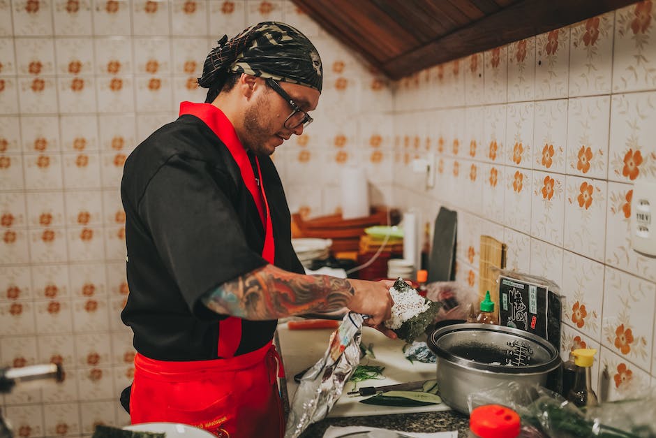 A picture of a sushi master in action in the kitchen