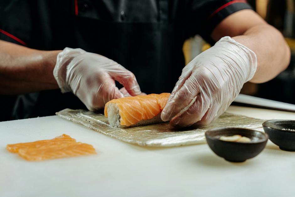 A picture of Tadashi Sogimoto preparing sushi in his restaurant