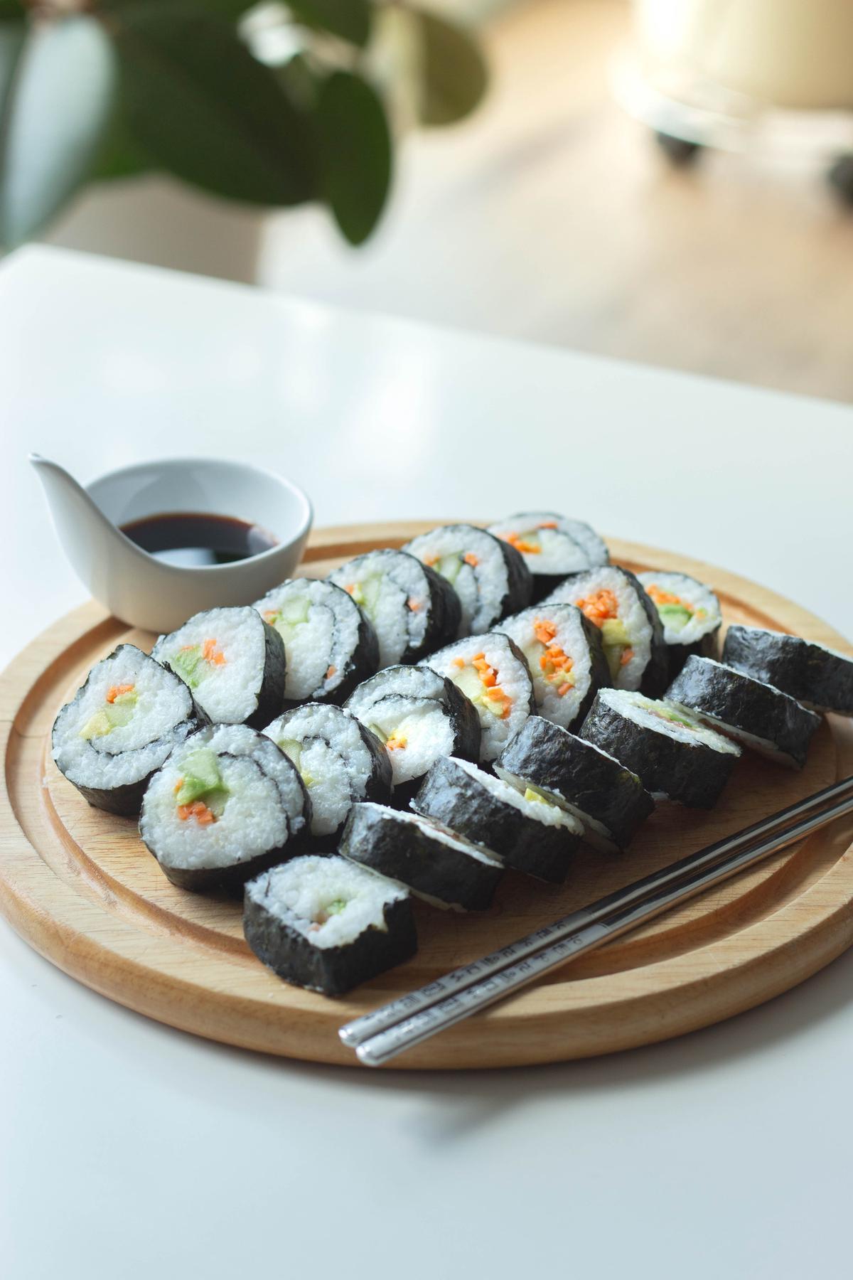 A plate of sushi rolls representing the diverse flavors and variations of sushi that have developed due to globalization